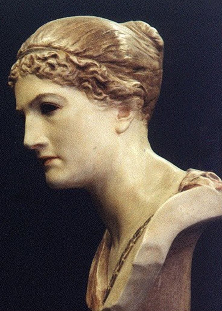 This may contain: a close up of a statue of a woman's head