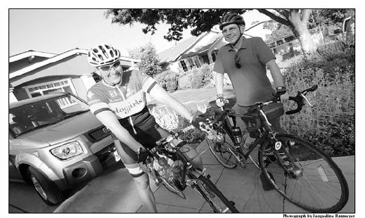 My husband and I in our driveway in California about to commute to work by bicycle.