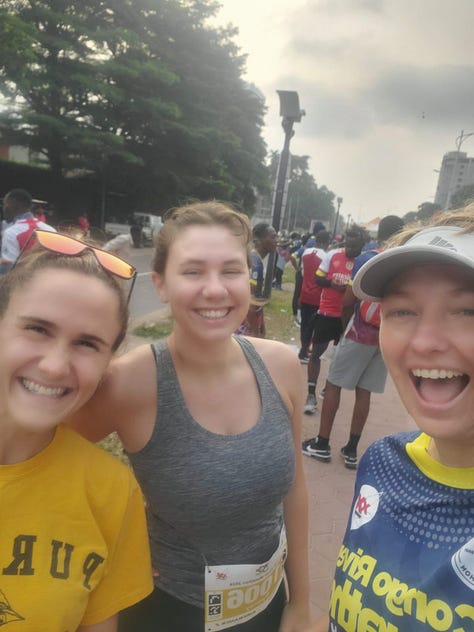 Runners are racing down a long boulevard and gathered around the starting line