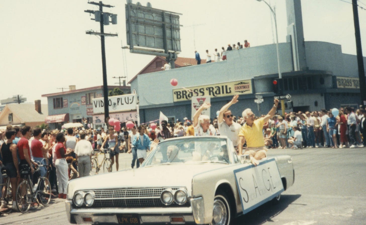 Lincoln Continental convertible passing in front of the Brass Rail, one of San Diego's first gay bars