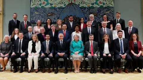 Reuters Canada's Prime Minister Mark Carney and Governor General Mary Simon pose for a family photo with newly sworn in cabinet members.