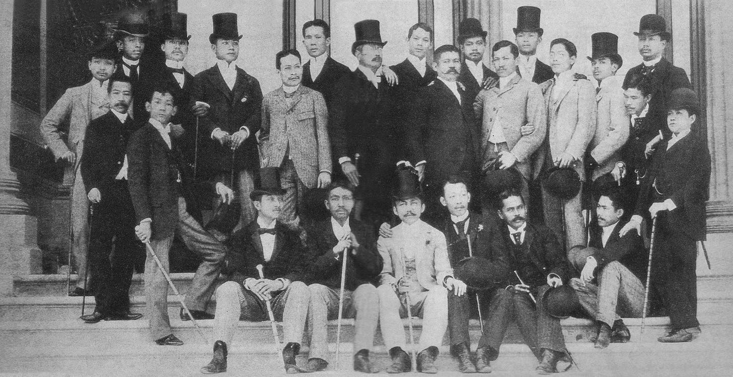 A black-and-white photo scan of a collective of richly-dressed Filipinos in Madrid, Spain.