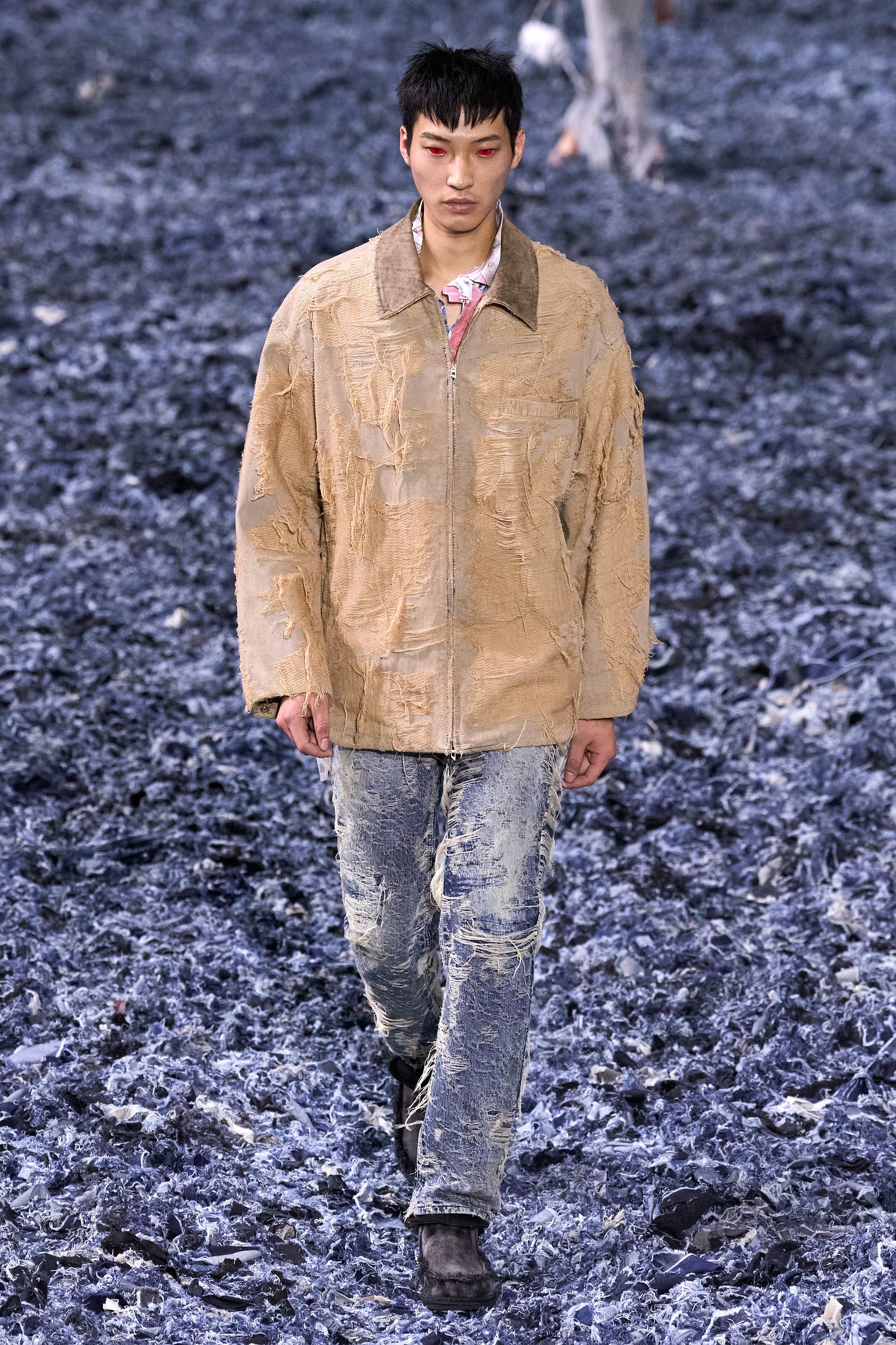 Image may contain Clothing Coat Person Standing Adult Pants Footwear and Shoe