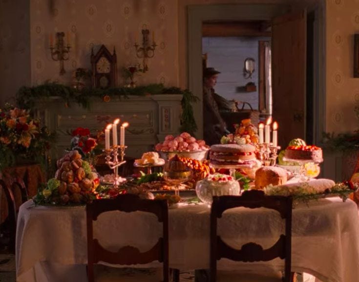 This may contain: a dining room table covered in food and candles