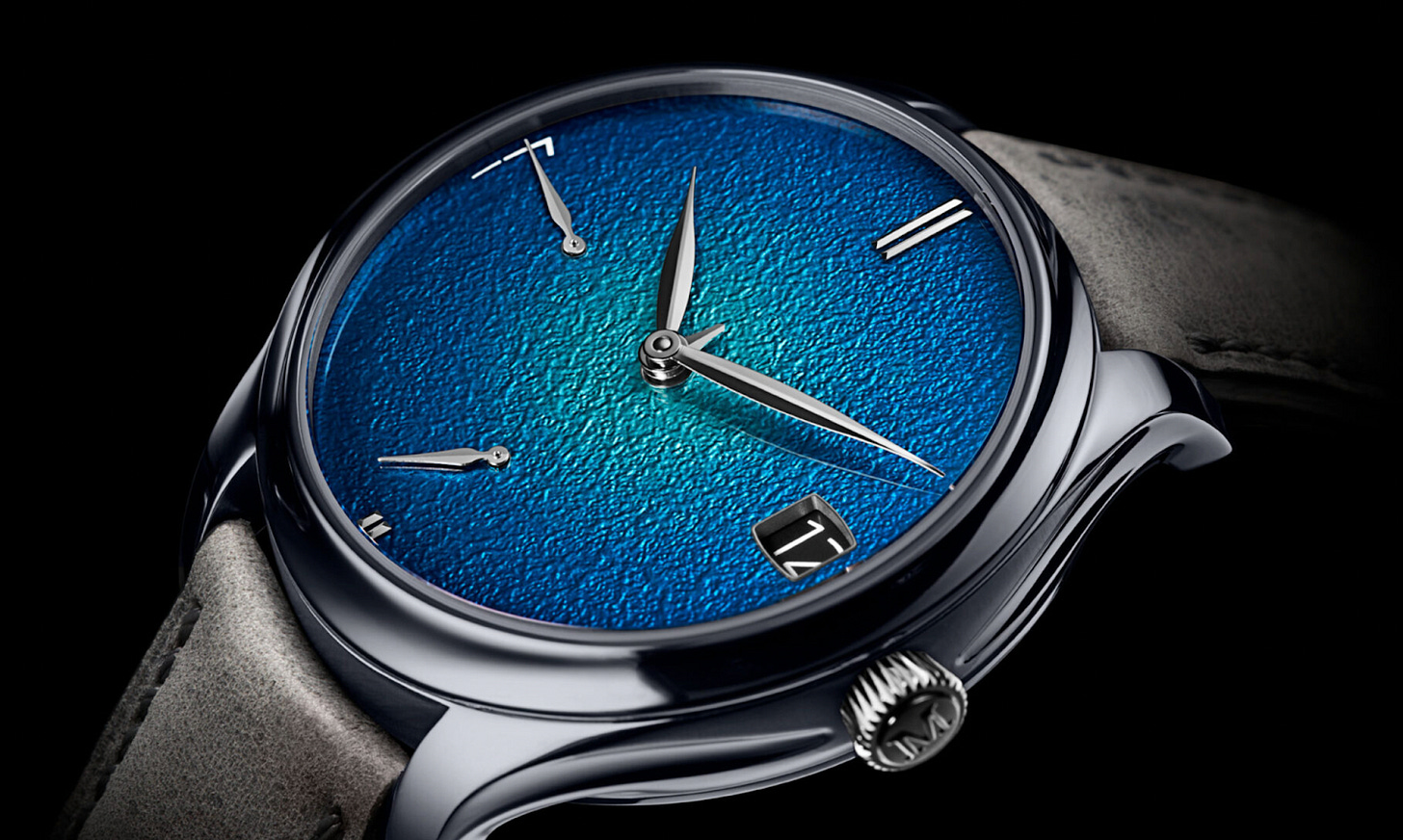 An H. Moser & Cie. Endeavour Perpetual Calendar watch featuring tantalum metal, vibrant grand feu enamel dial, double hairspring movement for precision, and a minimalist design that enhances its intuitive and legible perpetual calendar function. An H. Moser & Cie. Endeavour Perpetual Calendar watch featuring tantalum metal, vibrant grand feu enamel dial, double hairspring movement for precision, and a minimalist design that enhances its intuitive and legible perpetual calendar function.