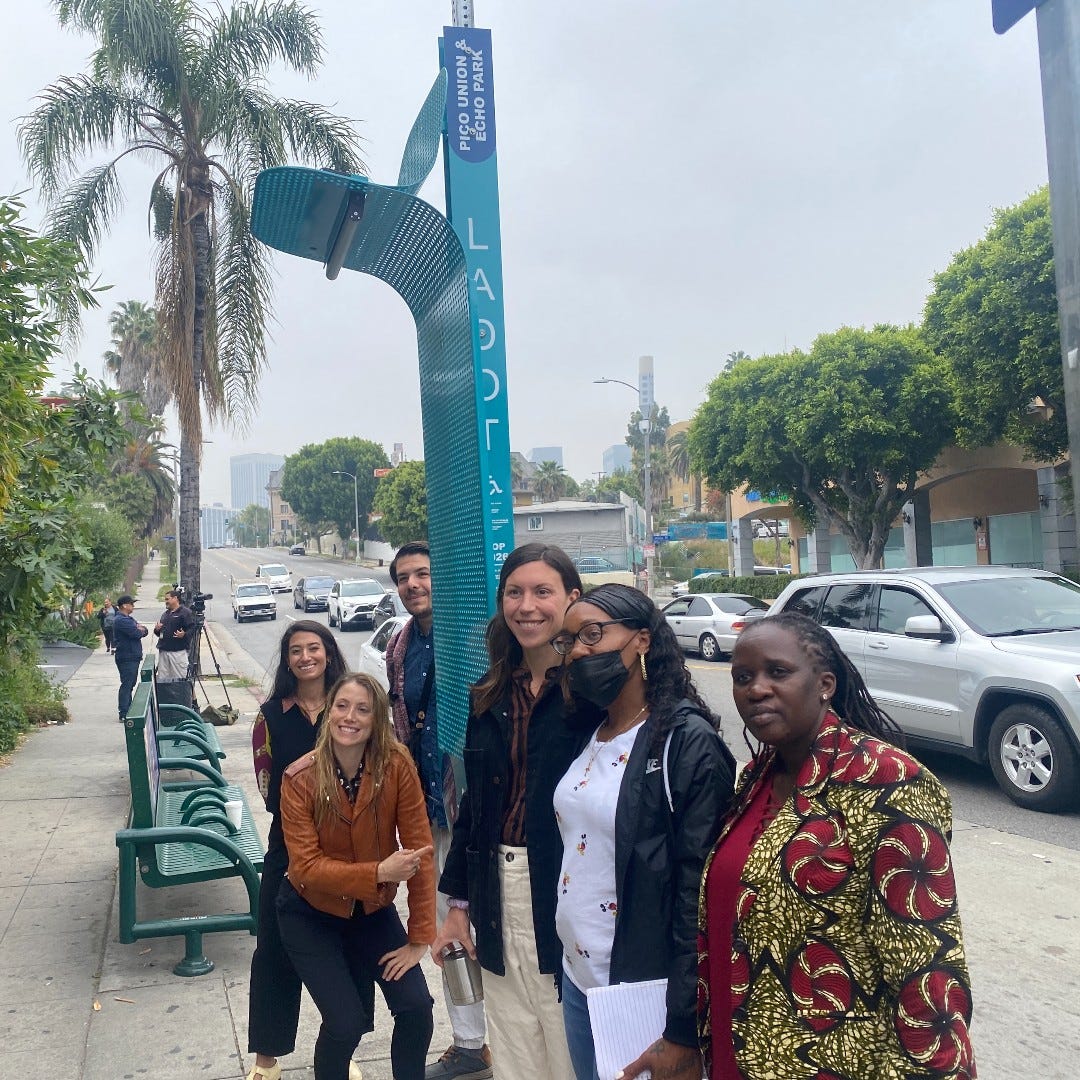 Project managers for La Sombrita pose with new shade structure