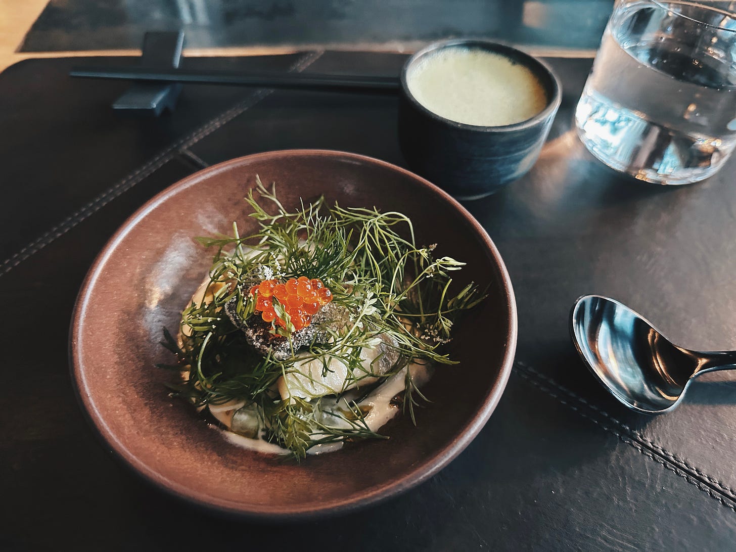 The Wolf's Tailor Denver tasting menu course with grain-forward plating and microgreens The Wolf's Tailor Denver tasting menu course with grain-forward plating and microgreens
