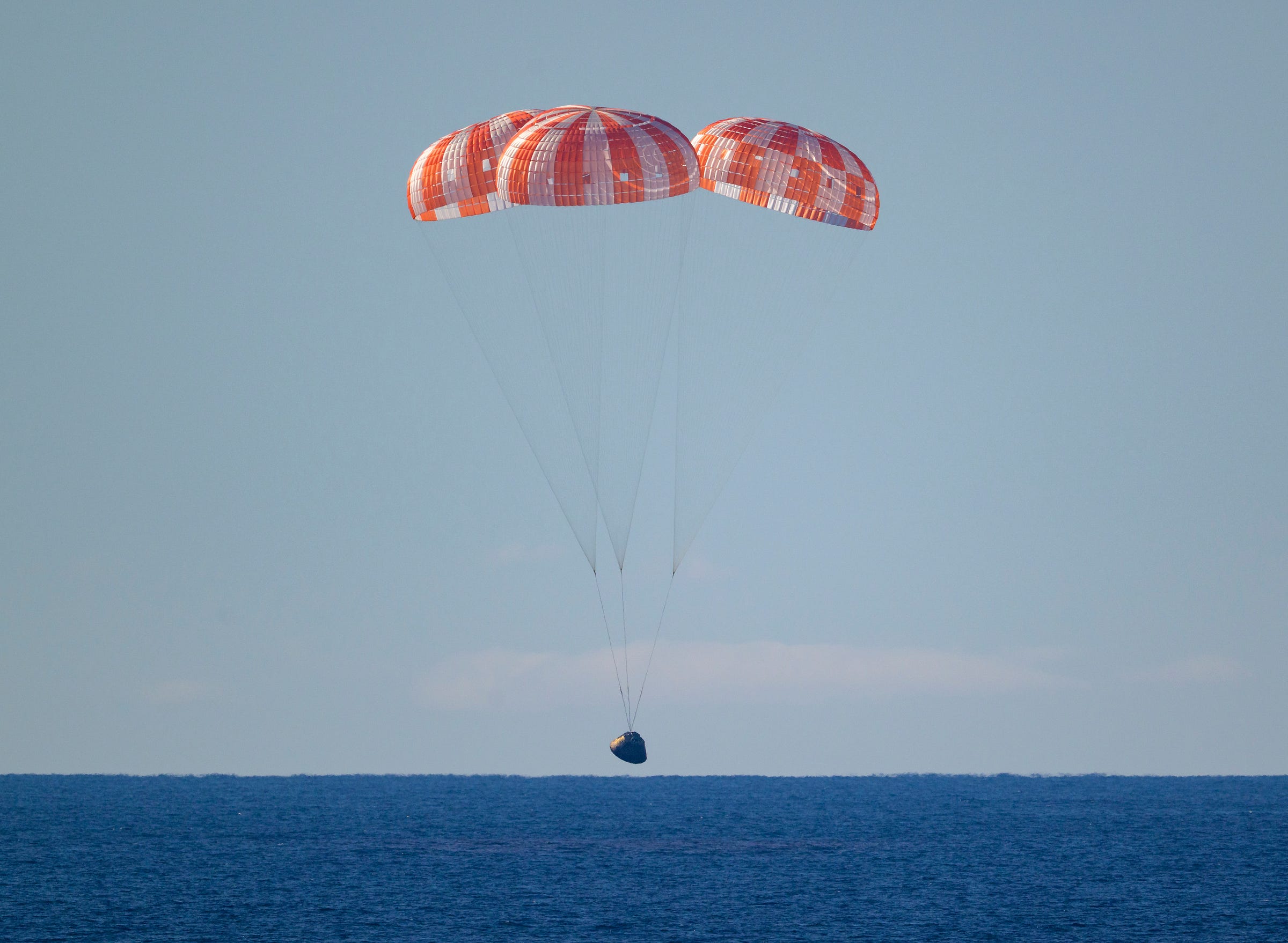 Artemis II Recovery NASA’s Orion spacecraft with Artemis II crewmembers NASA astronauts Reid Wiseman, commander; Victor Glover, pilot; Christina Koch, mission specialist; and CSA (Canadian Space Agency) astronaut Jeremy Hansen, mission specialist aboard is seen under parachutes as it lands in the Pacific Ocean off the coast of California, Friday, April 10, 2026. NASA’s Artemis II mission took Wiseman, Glover, Koch, and Hansen on a 10-day journey around the Moon and back to Earth. Following a splashdown at 7:07 p.m. EDT, NASA, U.S. Navy, and U.S. Air Force teams are working to bring the crewmembers and Orion spacecraft aboard USS John P. Murtha.  Image Credit: NASA/Bill Ingalls