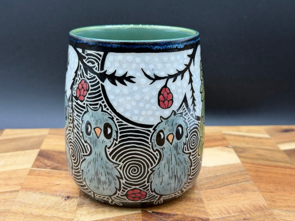 Another side of the mug, two cute grey Kākāpō chicks are visible and three red rimu fruit that look like berries, one on the floor and two hanging from wiry branches.