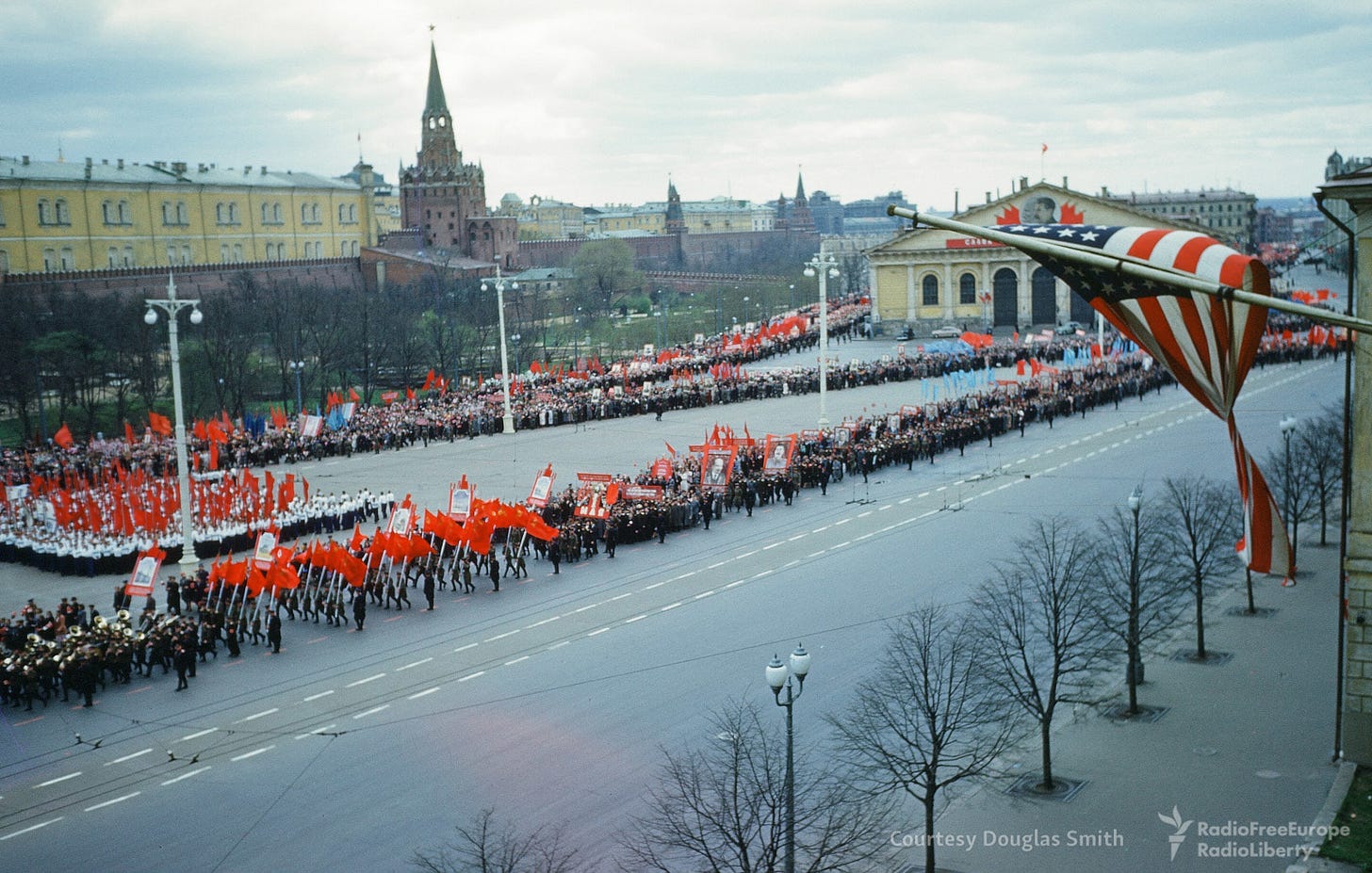 A public parade marches boldly in front of the former U.S. Embassy building on Manezhnaya ploshchad, Moscow, a Cold War era spectacle. A public parade marches boldly in front of the former U.S. Embassy building on Manezhnaya ploshchad, Moscow, a Cold War era spectacle.