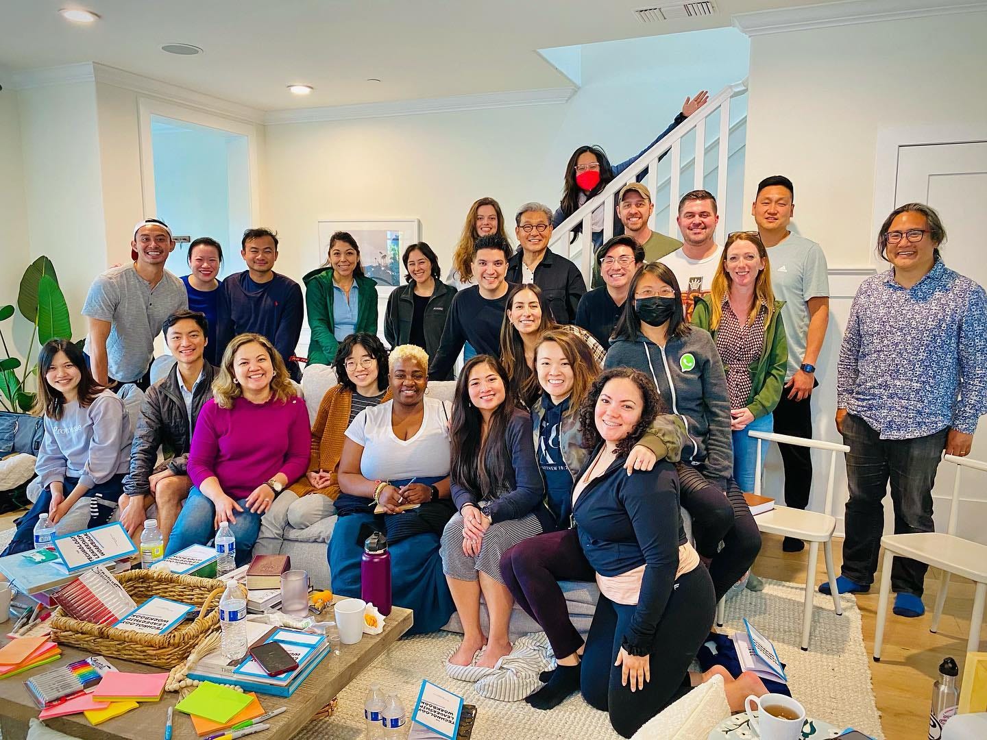 May be an image of 12 people, people standing, people sitting and indoor