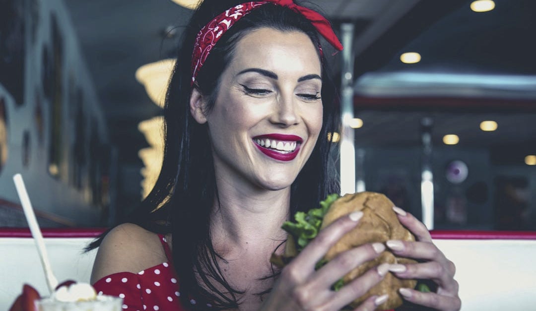 woman eats burger woman eats burger