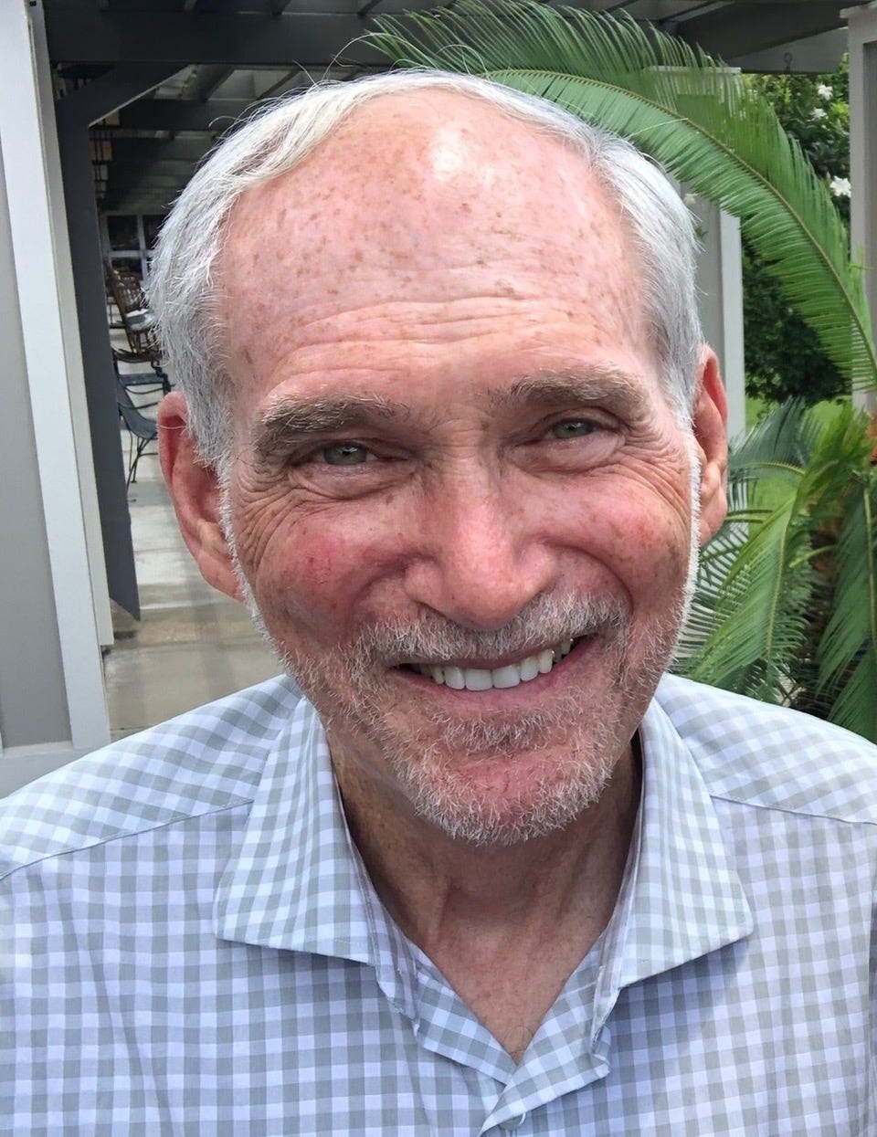 A portrait style of photo of an older man