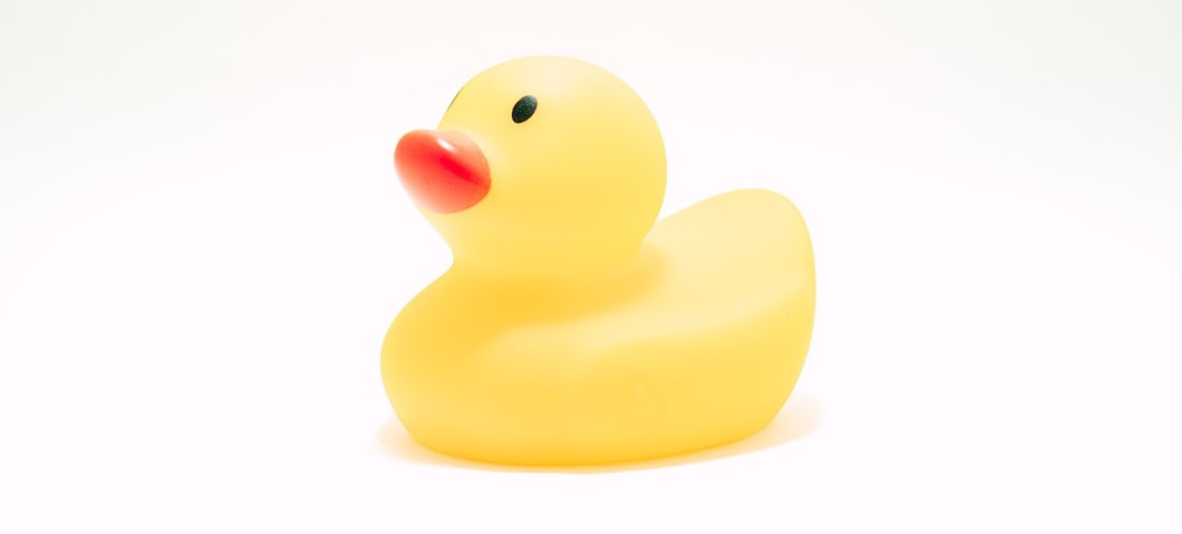 yellow rubber duck on white background