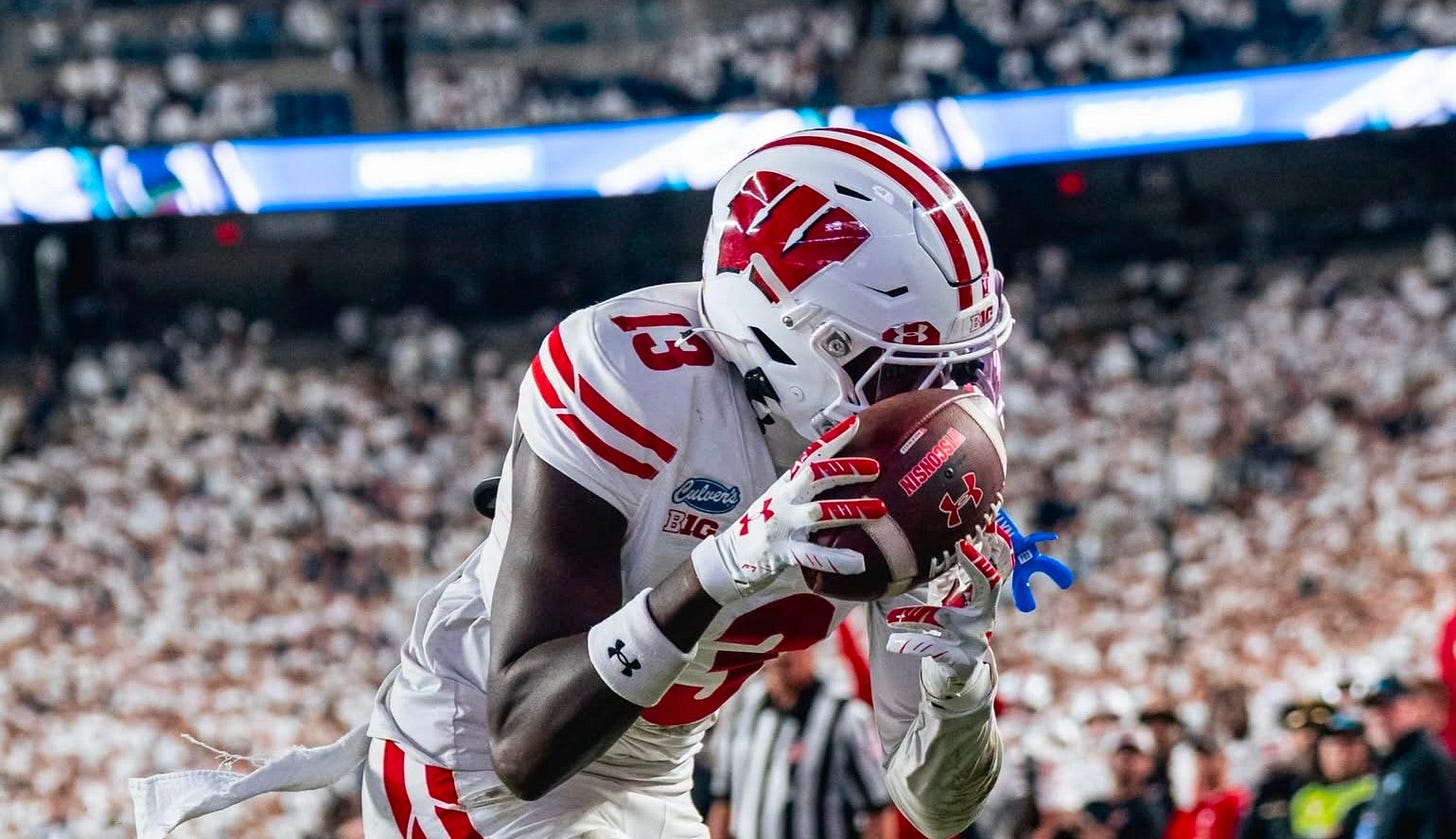 Wisconsin wide receiver Eugene Hilton Jr. catches an 18-yard touchdown against Penn State. Wisconsin wide receiver Eugene Hilton Jr. catches an 18-yard touchdown against Penn State.