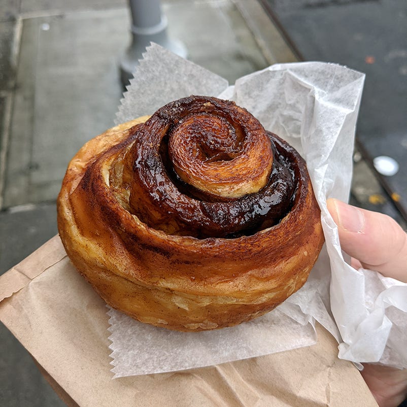 photo of a croissant-like cinnamon roll