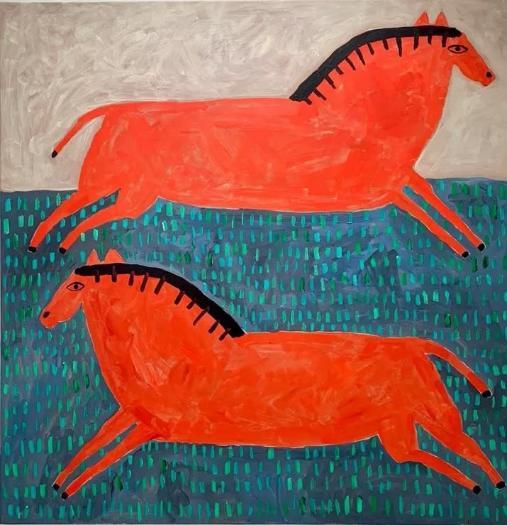 This may contain: two orange horses are running in the grass