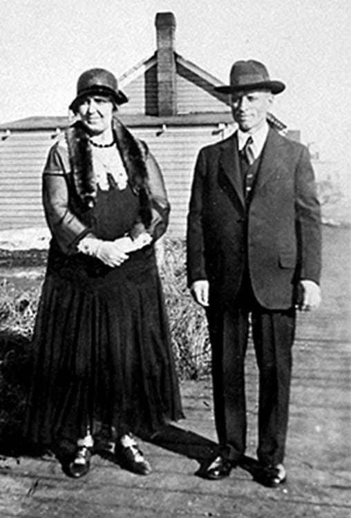 Evan Jones and his wife, Bronwen standing in front of thier Anchorage, Alaska home in 1932.