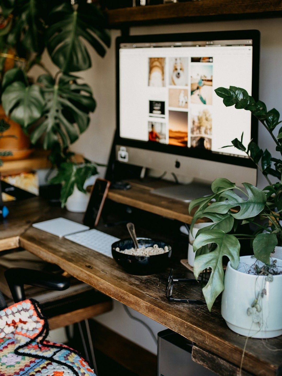black ashtray on brown wooden table