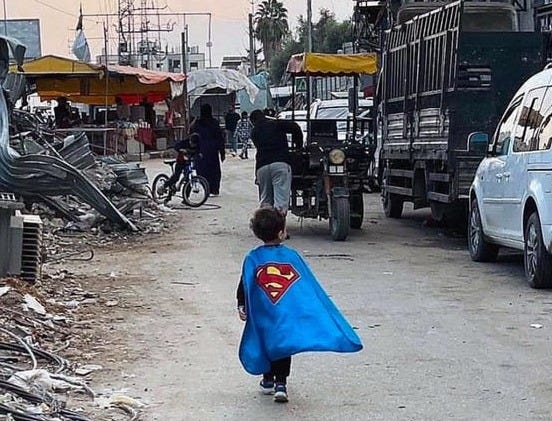 A Palestinian child walks the war torn streets in Gaza in their Superman  costume, November 5th 2024 : r/superman