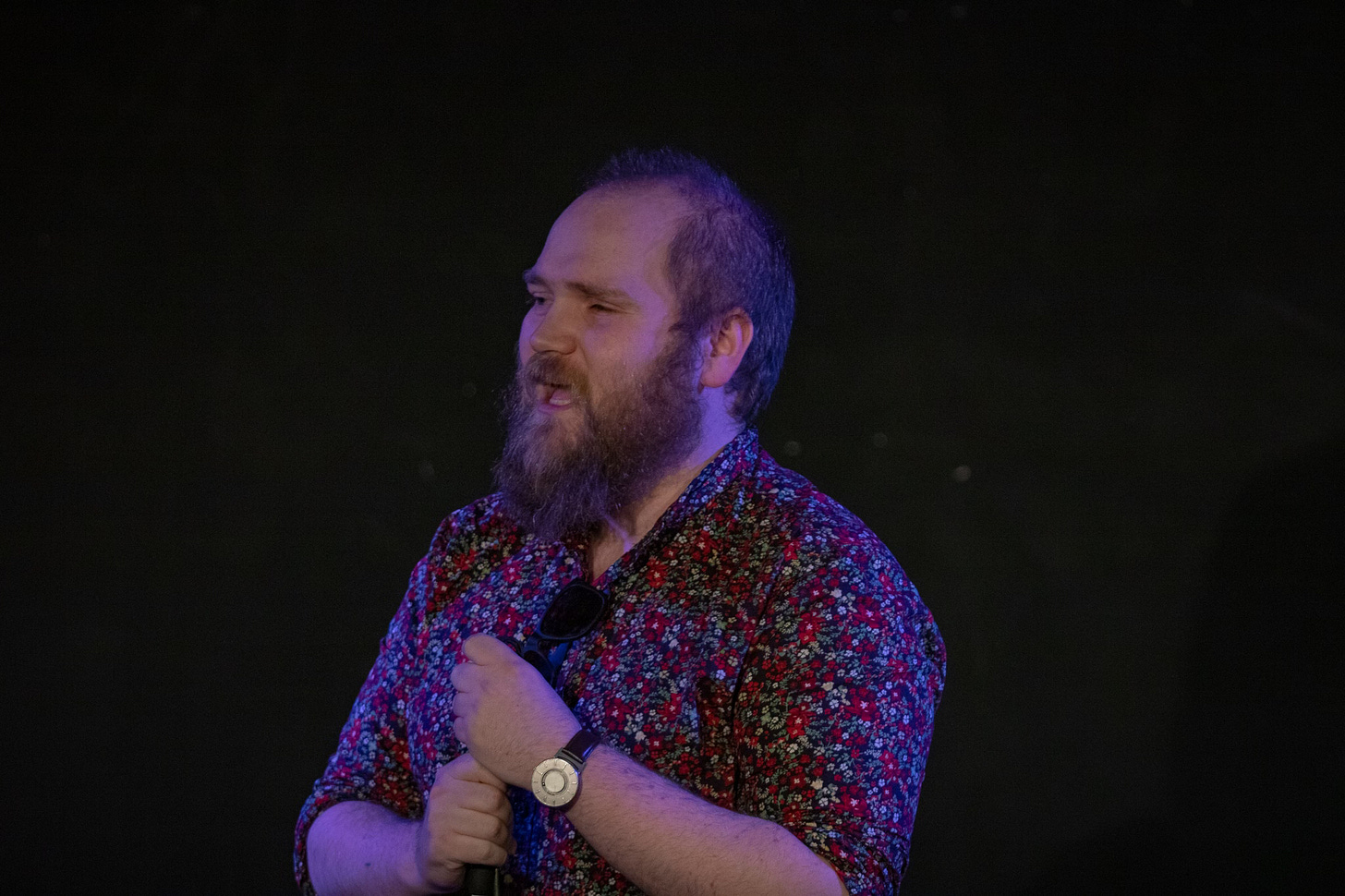 Ben Wilson, a white man with short hair and a blonde beard, wears a floral shirt and talks mid-sentence Ben Wilson, a white man with short hair and a blonde beard, wears a floral shirt and talks mid-sentence