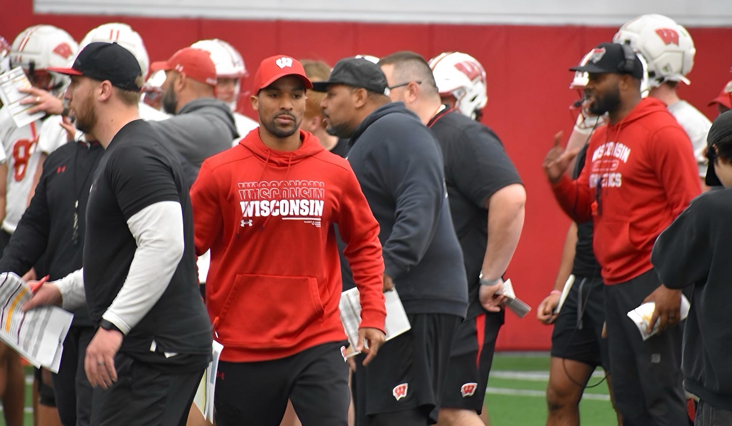 Wisconsin Badgers wide receivers coach Ari Confesor on the field during an indoor practice. Wisconsin Badgers wide receivers coach Ari Confesor on the field during an indoor practice.
