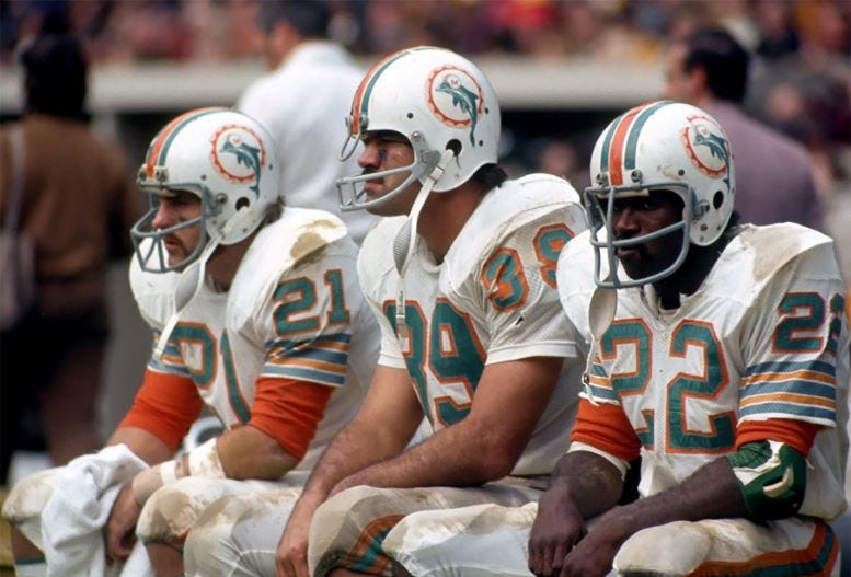 Running backs, from left to right, Jim Kiick, Larry Csonka, and Mercury Morris, all draft picks of the Miami Dolphins from 1968 - 69. Running backs, from left to right, Jim Kiick, Larry Csonka, and Mercury Morris, all draft picks of the Miami Dolphins from 1968 - 69.