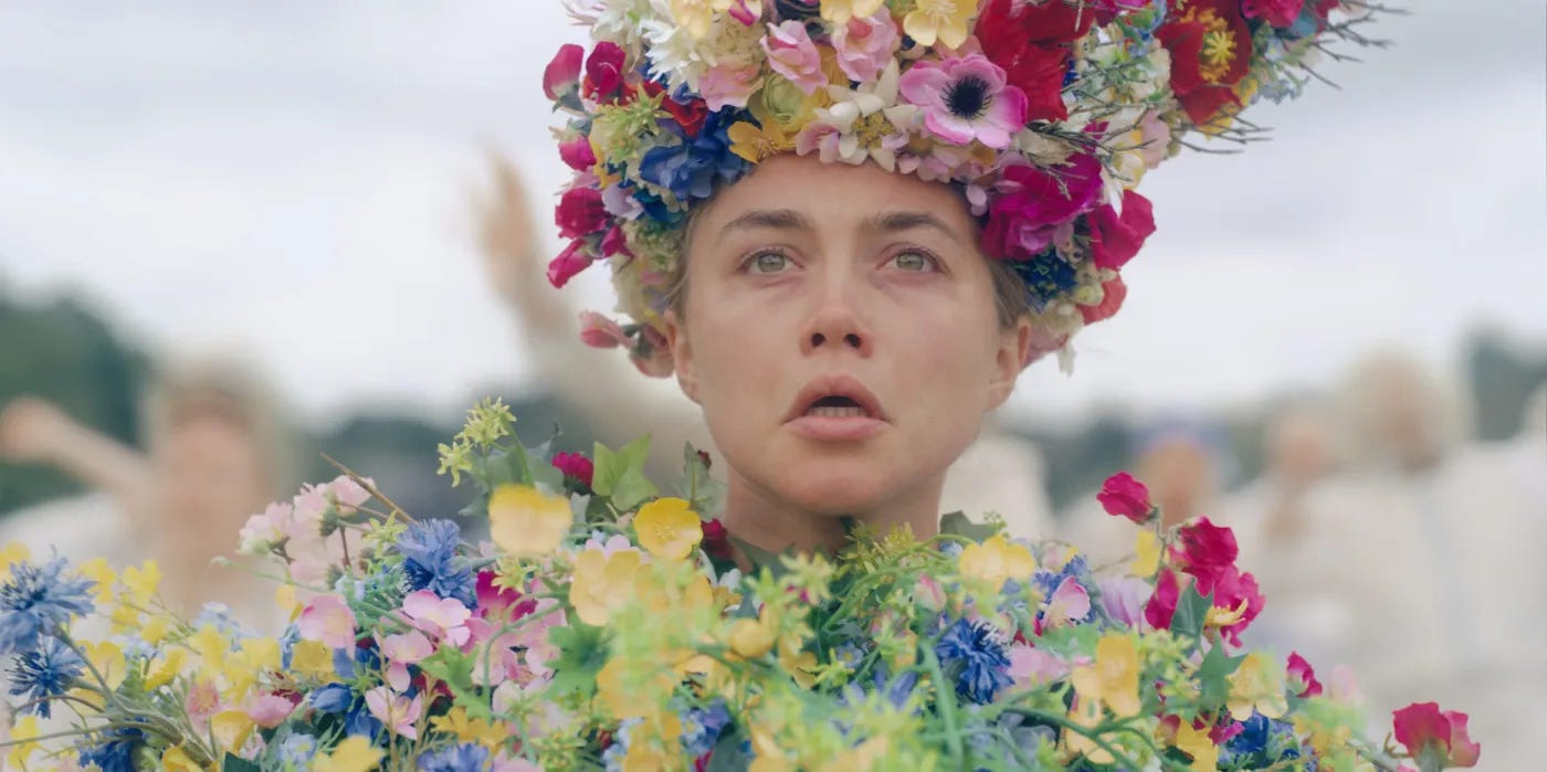 headshot of Florence Pugh, draped in flowers headshot of Florence Pugh, draped in flowers