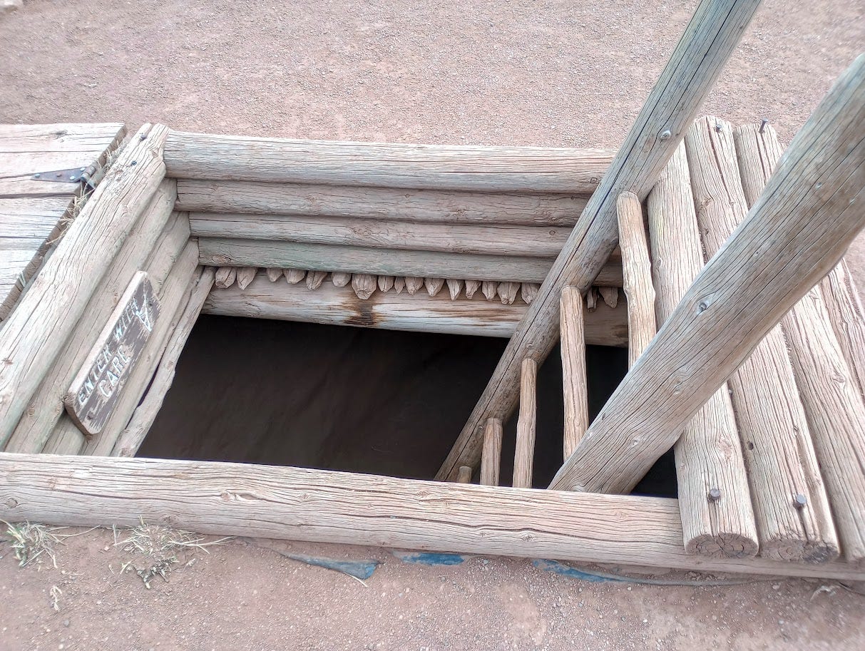 Ladder descending through trap door