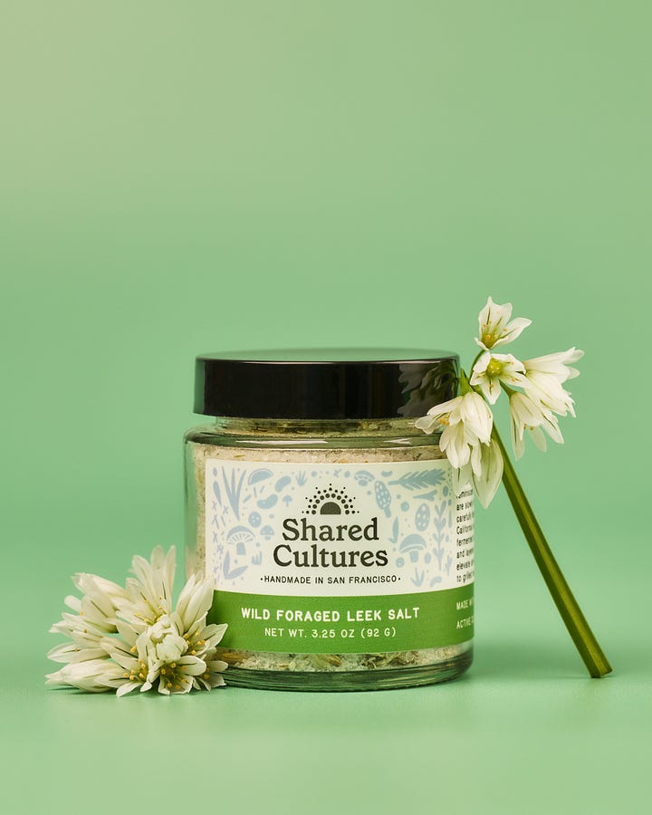 jar of leek salt front label and salt close up with leek flowers