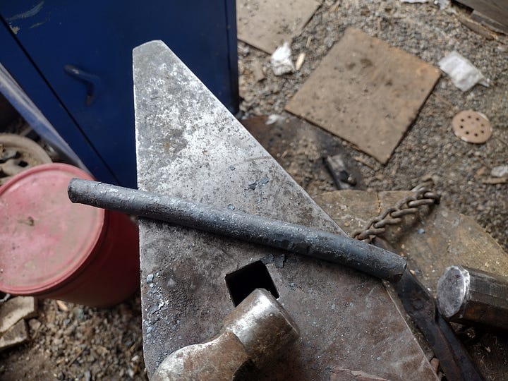 The straightened spring, and the two finished fullers.