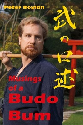 Image of cover of Musings Of A Budo Bum. Peter Boylan holding a jo staff. Image of cover of Musings Of A Budo Bum. Peter Boylan holding a jo staff.