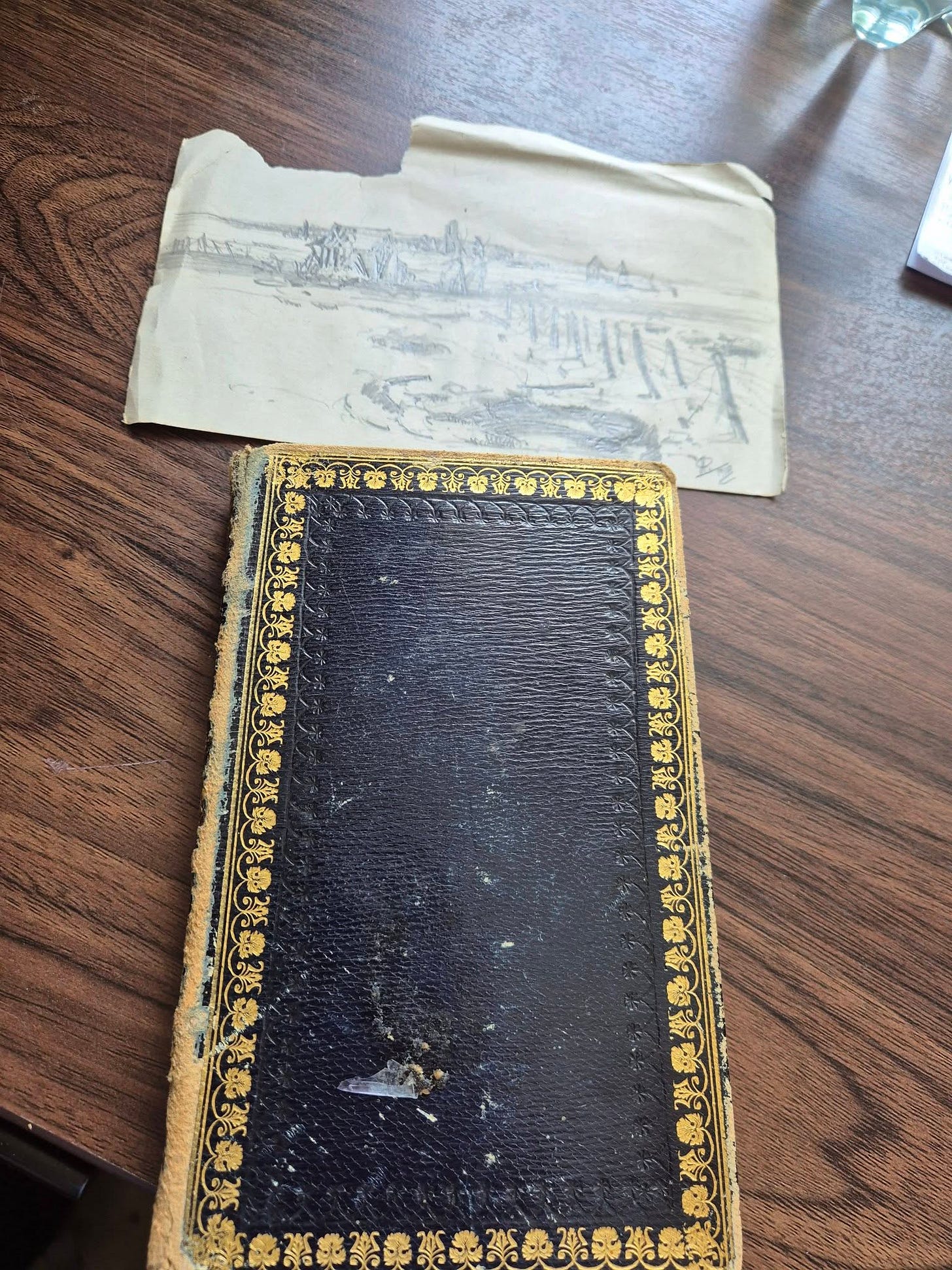 May be an image of book, diary and text