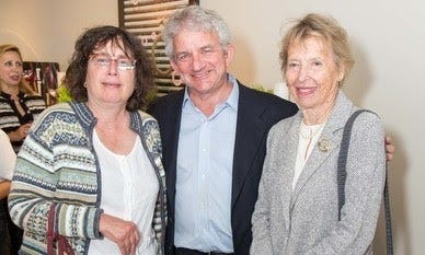 A photo of three older white people, with Georgia Schuttish on the left-hand side