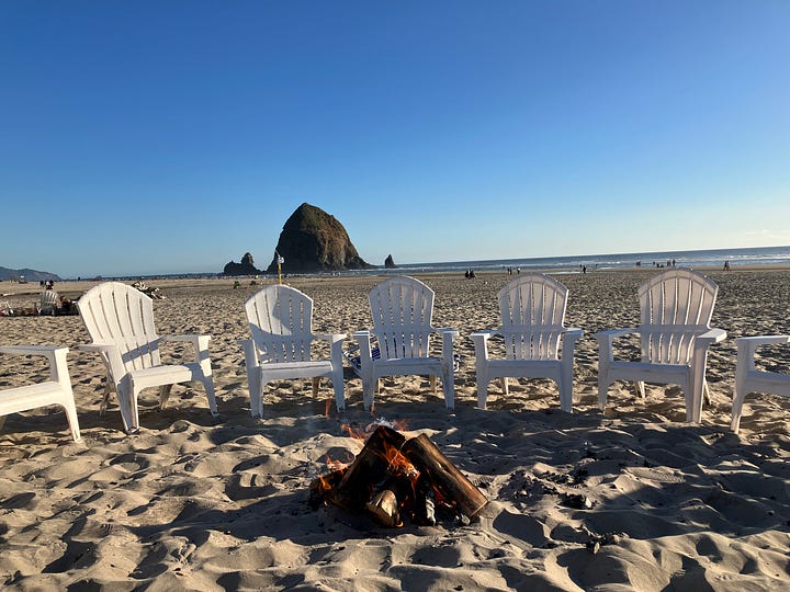 Oregon coast, Haystack Rock at Cannon Beach, chairs and fire for roasting marshmellows