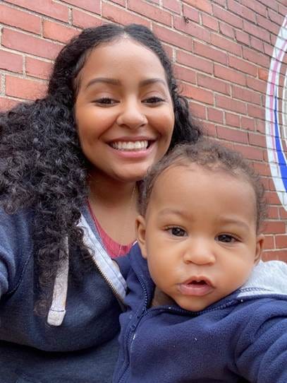 A smiling woman and her young son