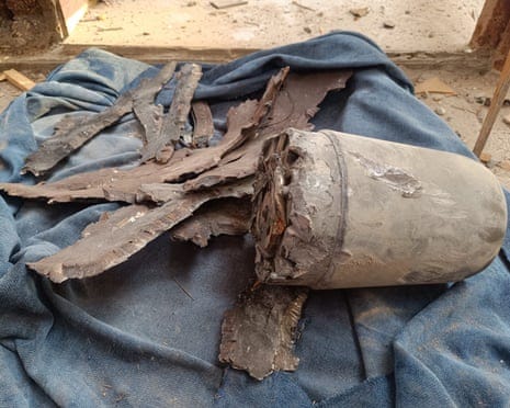 A grey bomb fragment on a blue blanket A grey bomb fragment on a blue blanket