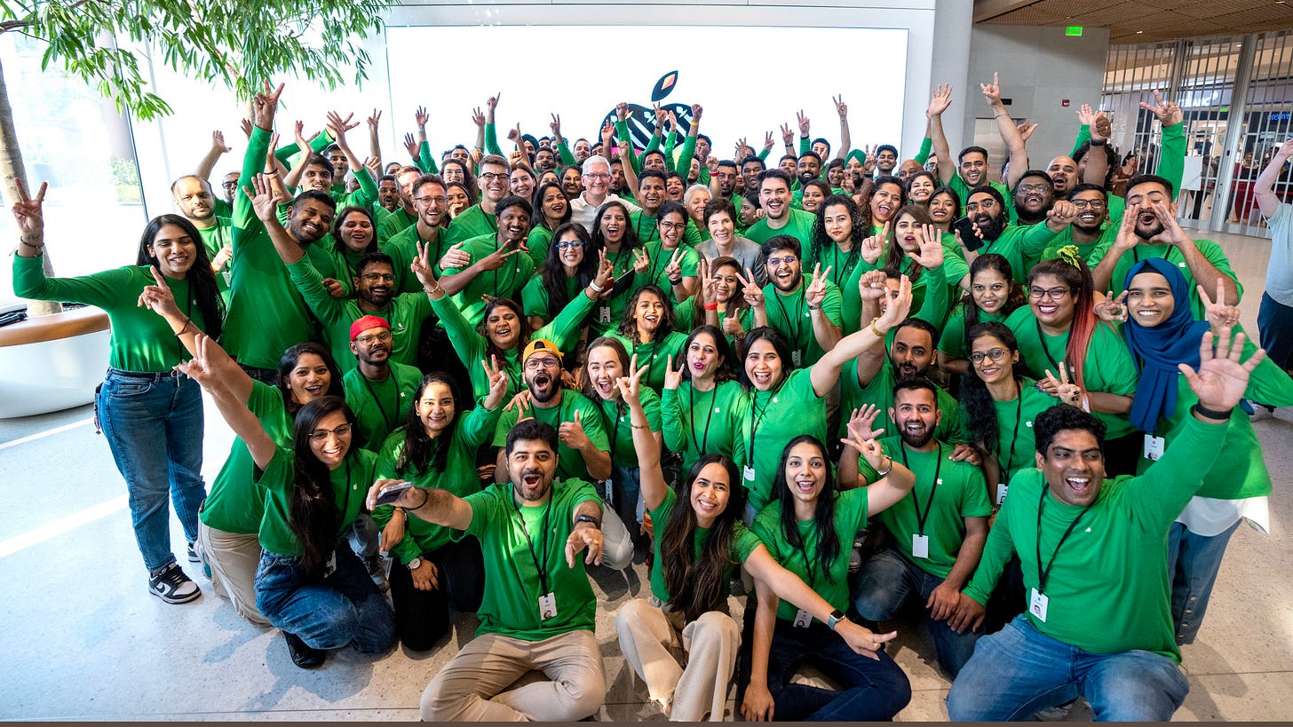 Tim, Deirdre, and the entire team at Apple BKC gather for a group photo.