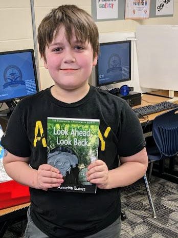 Kids holding books