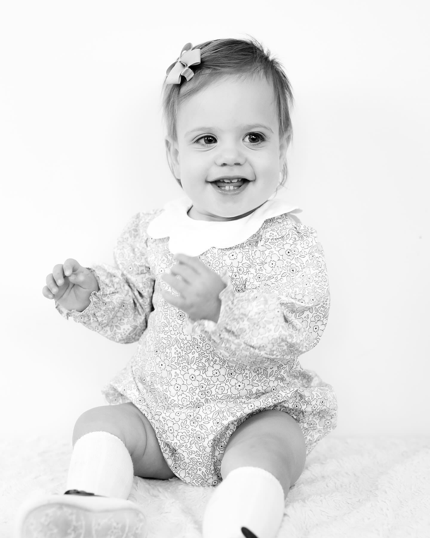 May be a black-and-white image of 1 person, baby and smiling