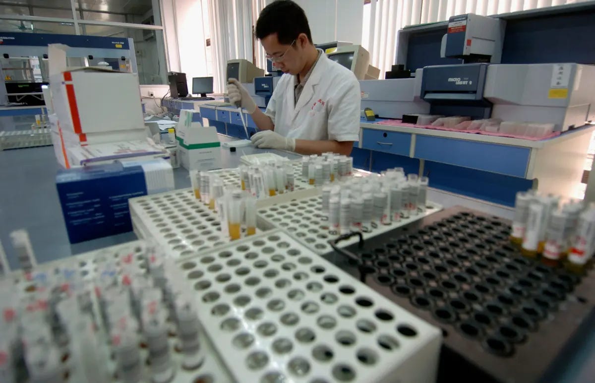An inspection worker tests blood samples from volunteer donors at the Guangzhou Blood Centre in Guangzhou of Guangdong Province, China, on June 13, 2005. (China Photos/Getty Images) An inspection worker tests blood samples from volunteer donors at the Guangzhou Blood Centre in Guangzhou of Guangdong Province, China, on June 13, 2005. (China Photos/Getty Images)