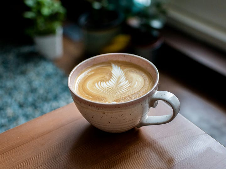 Flat White with rosetta foam art. Photo: Joe Hepburn via Unsplash. Conchas by Blue Arauaz via pexels