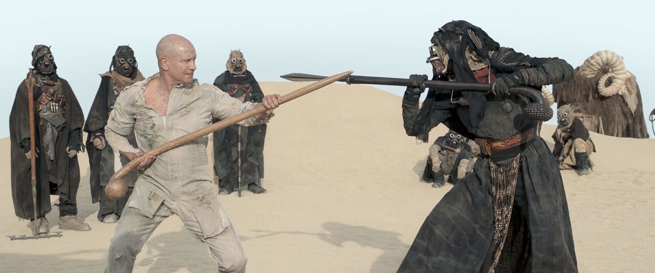 In a vision from the past, now accepted within the Tusken camp, he trains in the ways of the gaffi stick. But tragedy soon strikes, as sharpshooters from a passing train kill several members of the tribe. 