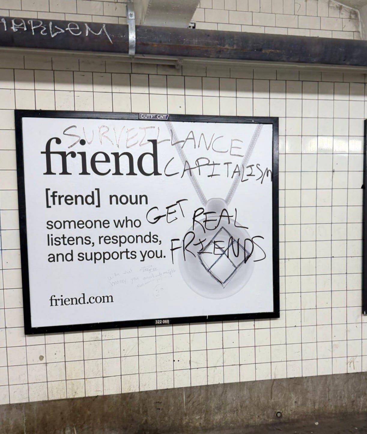An ad for "friend" with graffiti that reads: SURVEILLANCE CAPITALISM and GET REAL FRIENDS
