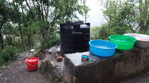 Pictures of life volunteering in disaster relief in Nepal. Tents in a courtyard, people sitting around reading books and playing games, standing on top of a damaged building, and buckets they used for washing.