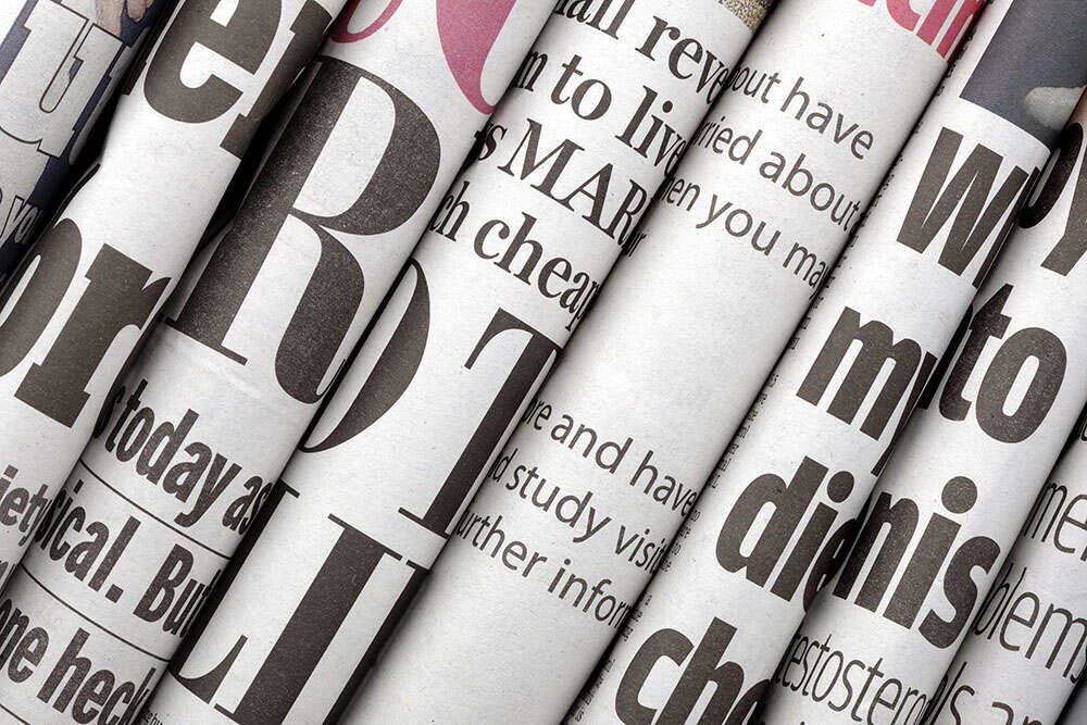 Several folded newspapers pressed together, illustrating a story about the latest regional newspaper ABC figures, showing no daily regional paper now has a print circulation of 20,000 or more.