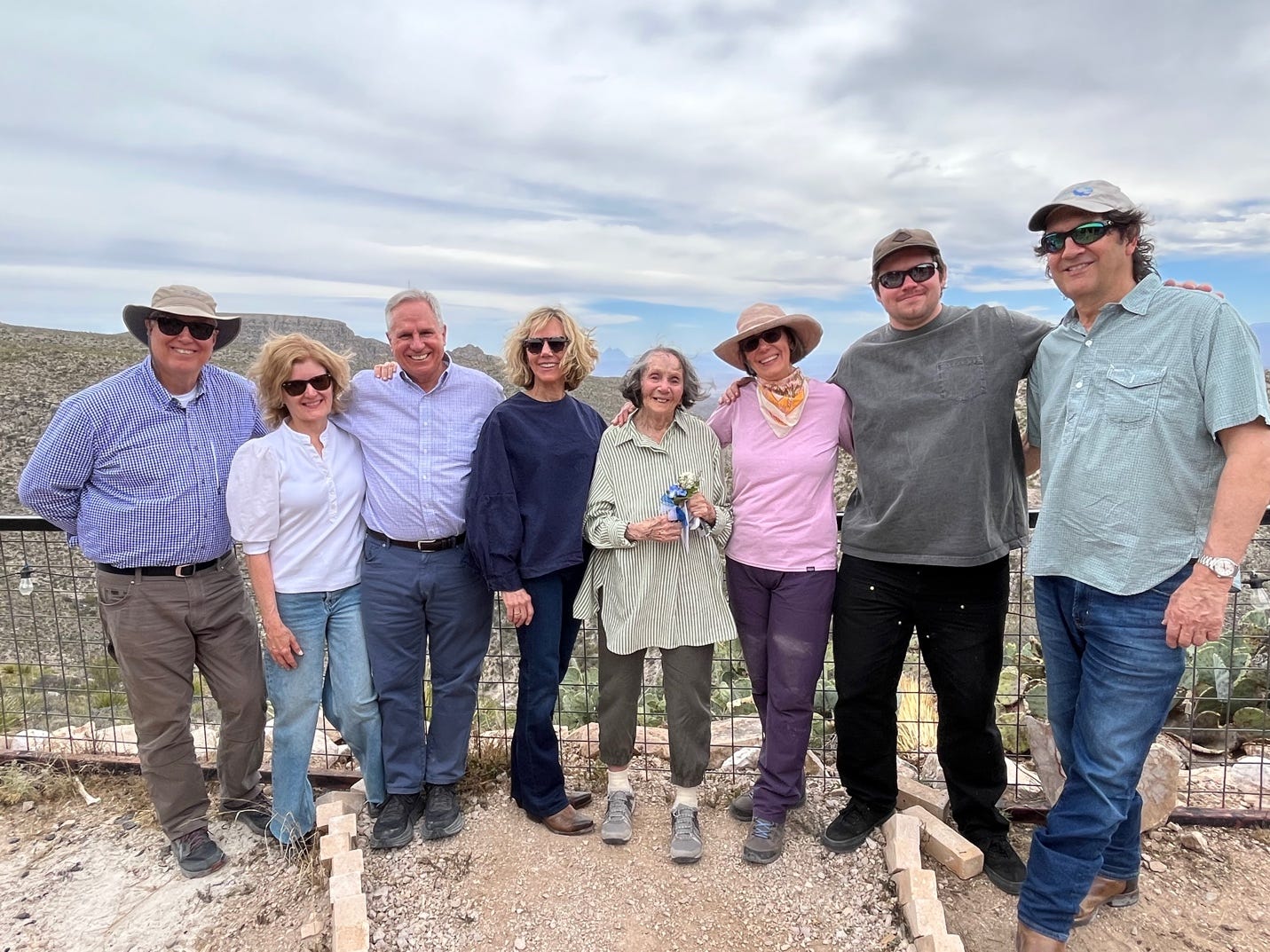 A group of people posing for a photo

Description automatically generated