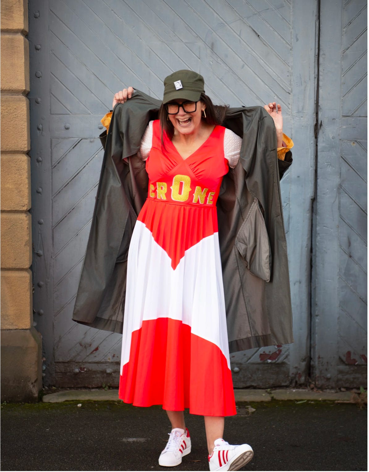 A person in a red and white dress and hat

AI-generated content may be incorrect.