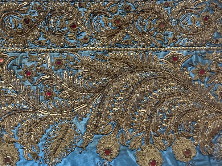 Detail of silk fabric and gold thread from a matador's traje de luces 