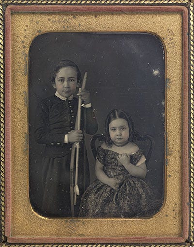 Black and white framed daguerrotype images of siblings and a married couple from the 1840s